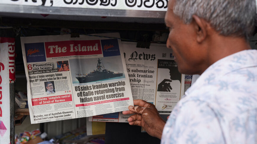 A man checks the local newspaper, follwoing a submarine attack on the Iranian military ship, IRIS Dena, off the coast of Sri Lanka, in Galle, Sri Lanka, March 5, 2026. REUTERS/Thilina Kaluthotage