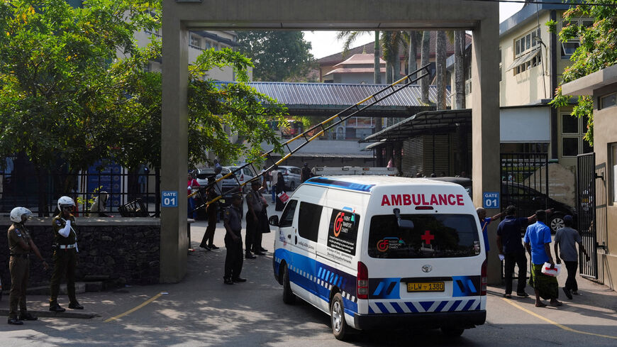 Security personnel stand guard as an ambulance enters inside the Galle National Hospital, following a submarine attack on the Iranian military ship, IRIS Dena, off the coast of Sri Lanka, in Galle, Sri Lanka, March 5, 2026. REUTERS/Thilina Kaluthotage REFILE - CHANGING NAME OF HOSPITAL