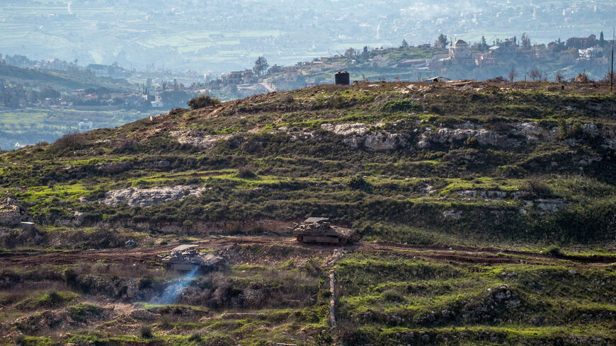 Israeli tanks drive on the Lebanese side of the Israel-Lebanon border as seen from Israel, March 3.  REUTERS/Gil Eliyahu