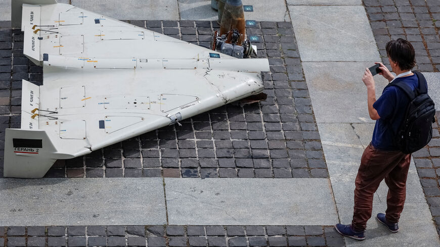 FILE PHOTO: A visitor of an exhibition takes a photo of parts of an Iranian made unmanned aerial vehicle (UAV) Shahed-131/136, which was launched on Ukrainian territories, amid Russia's attack on Ukraine, in Kyiv, Ukraine June 27, 2025. REUTERS/Alina Smutko/File Photo