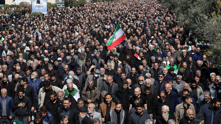 A man waves an Iranian flag, as Muslims attend Friday prayer, amid the U.S.-Israeli conflict with Iran, in Tehran, Iran, March 6, 2026. Majid Asgaripour/WANA (West Asia News Agency) via REUTERS