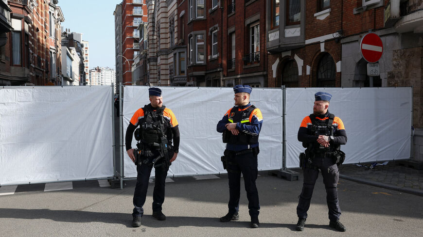 Police secure the site near a synagogue damaged by an explosion early on Monday, in Liege, Belgium, March 9, 2026. REUTERS/Yves Herman