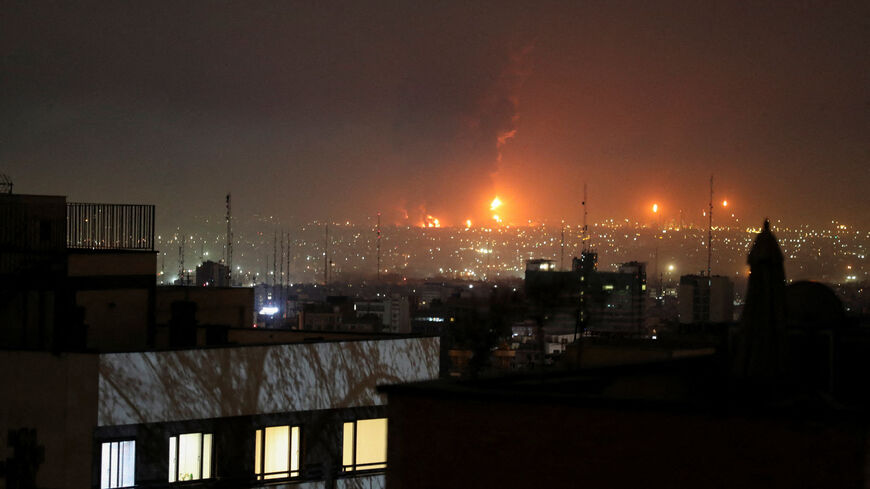 Smoke rises following an explosion in Tehran, March 7.  Stringer/WANA