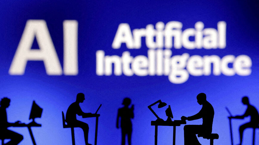 FILE PHOTO: Figurines with computers and smartphones are seen in front of the words "Artificial Intelligence AI" in this illustration created on February 19, 2024. REUTERS/Dado Ruvic/File Photo