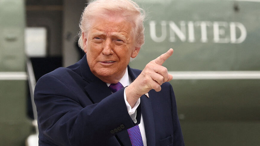 U.S. President Donald Trump gestures at Joint Base Andrews in Maryland, U.S., March 11, 2026. REUTERS/Kevin Lamarque