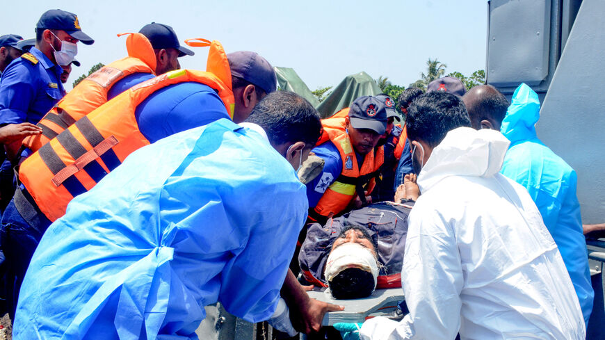 Medical personnel and Sri Lanka Navy sailors provide emergency treatment to an injured Iranian crew member rescued after responding to a distress call from the Iranian military ship, IRIS Dena, while at sea within Sri Lanka’s maritime search and rescue region, in Indian Ocean, Sri Lanka, March 4, 2026. Sri Lanka Navy/Handout via REUTERS