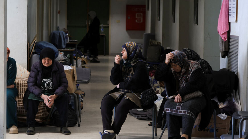 Women sit in a school turned shelter for people displaced from Beirut's southern suburbs and southern Lebanon, following an escalation between Hezbollah and Israel amid the U.S.-Israeli conflict with Iran, in Beirut, Lebanon, March 11, 2026. REUTERS/Mohamed Azakir