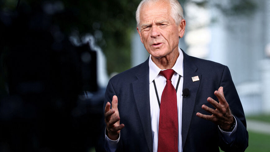 FILE PHOTO: White House trade advisor Peter Navarro speaks in front of TV camera at White House in Washington, D.C., U.S., July 7, 2025. REUTERS/Kevin Lamarque/File Photo