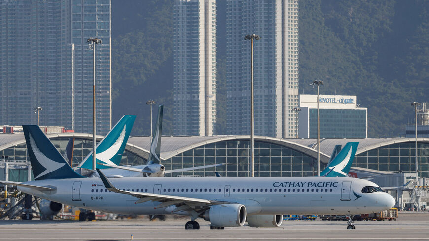 FILE PHOTO: A Cathay Pacific aircraft taxis at Hong Kong International Airport on the day of the official launch of its third runway, in Hong Kong, China November 28, 2024. REUTERS/Tyrone Siu/File Photo