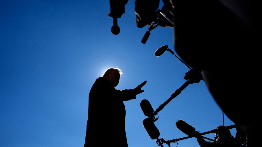 U.S. President Donald Trump speaks with the press before departing from the South Lawn at the White House in Washington, D.C., U.S., February 13, 2026. REUTERS/Kent Nishimura