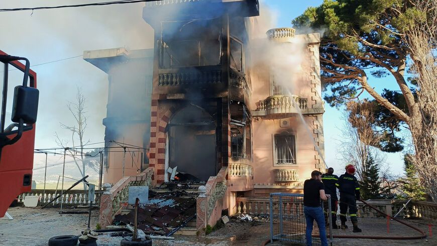 Members of the Lebanese Civil Defence work to extinguish a fire in a building after it was hit by an Israeli air strike, following an escalation between Hezbollah and Israel amid the U.S.-Israeli conflict with Iran, as seen from Marjayoun, Lebanon, March 17, 2026. Picture taken with a mobile phone. REUTERS/Karamallah Daher