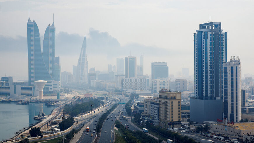 Smoke rises over the capital Manama, following a reported Iranian drone strike on the fuel storage facility of Bahrain International Airport, amid the U.S.-Israeli conflict with Iran, in Muharraq, Manama, Bahrain, March 12, 2026. REUTERS/Stringer/File Photo