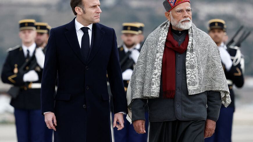 FILE PHOTO: French President Emmanuel Macron and Indian Prime Minister Narendra Modi attend a departure ceremony at Marseille Provence airport in Marignane as part of a visit in Marseille, France, February 12, 2025.  REUTERS/Christian Hartmann/Pool/ File Photo