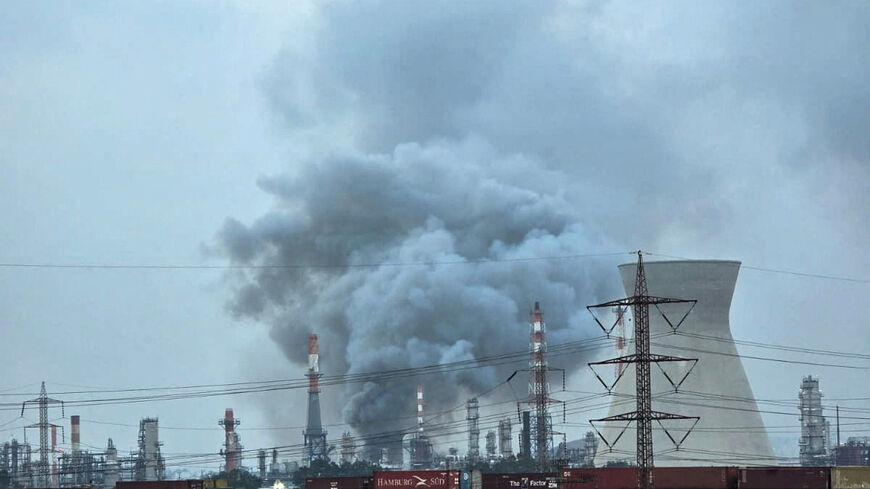 Smoke rises from an oil refinery that was damaged in an Iranian attack, amid the U.S.-Israel conflict with Iran, in Haifa, Israel, March 19, 2026. REUTERS/Sharon Sztrozenberg