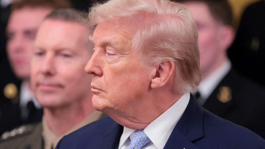 U.S. President Donald Trump looks on during a presentation of the Commander-in-Chief's trophy to the U.S. Navy Midshipmen football team of the United States Naval Academy, at the White House in Washington, D.C., U.S., March 20, 2026. REUTERS/Kylie Cooper