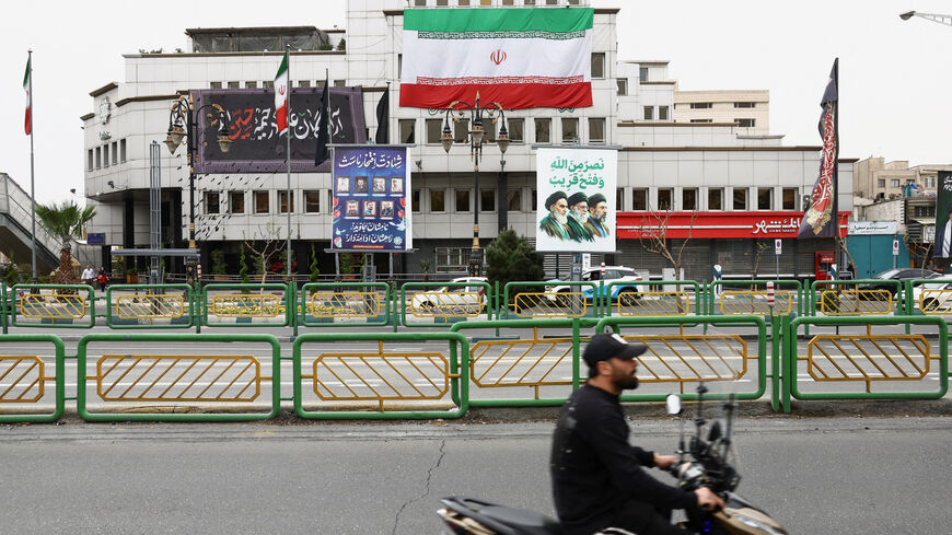 A banner with a picture of the late leader of the Islamic Revolution, Ayatollah Ruhollah Khomeini, and the late Supreme Leader of Iran, Ayatollah Ali Khamenei and Iran's new Supreme Leader, Mojtaba Khamenei, is displayed on a street, amid the U.S.-Israeli conflict with Iran, in Tehran, Iran, March 23, 2026. Majid Asgaripour/WANA (West Asia News Agency) via REUTERS