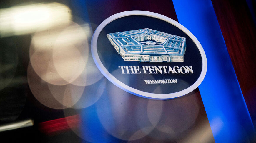 FILE PHOTO: The Pentagon logo is seen behind the podium in the briefing room at the Pentagon in Arlington, Virginia, U.S., January 8, 2020. REUTERS/Al Drago/File Photo
