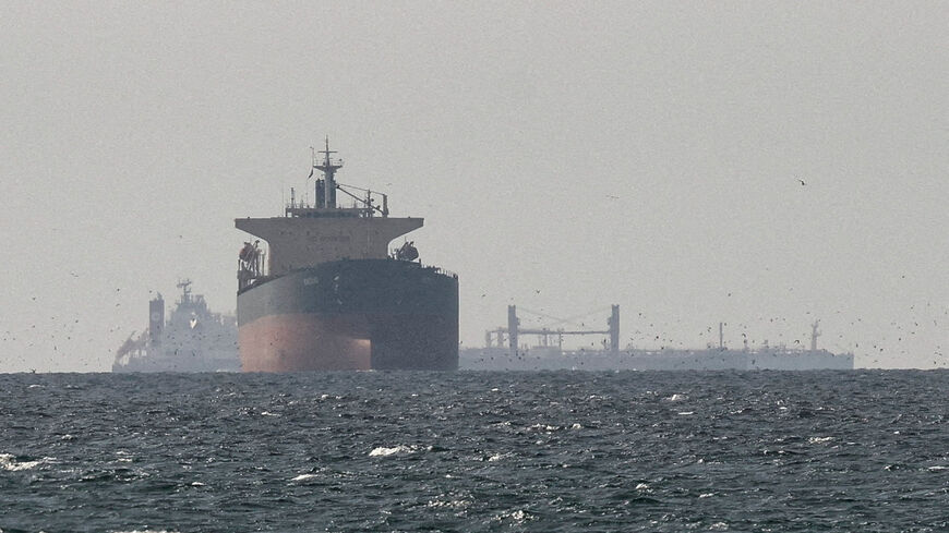 FILE PHOTO: Cargo ships in the Gulf, near the Strait of Hormuz, as seen from northern Ras al-Khaimah, near the border with Oman?s Musandam governance, amid the U.S.-Israeli conflict with Iran, in United Arab Emirates, March 11, 2026. REUTERS/Stringer/File Photo