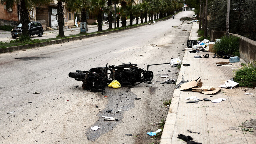 The remains of a motorbike used by two paramedics killed in an Israeli strike lie at the site, amid escalating hostilities between Israel and Hezbollah, as the U.S.-Israeli conflict with Iran continues, in Nabatieh, Lebanon, March 25, 2026. REUTERS/Yara Nardi