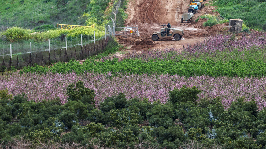 An Israeli military jeep drives to the border with Lebanon, amid escalating hostilities between Israel and Hezbollah, as the U.S.-Israeli conflict with Iran continues, in northern Israel, March 25, 2026. REUTERS/Tyrone Siu