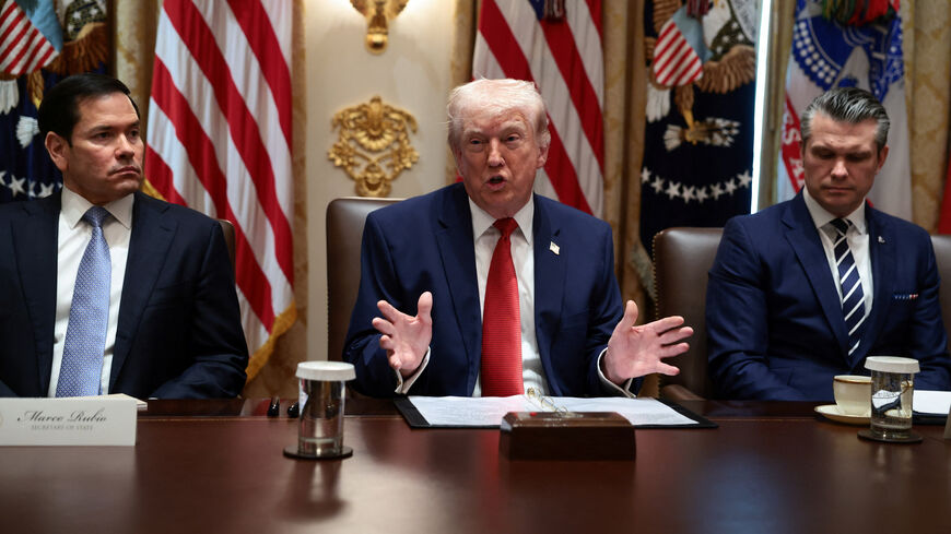 U.S. President Donald Trump, sitting next to Secretary of State Marco Rubio and Defense Secretary Pete Hegseth, speaks during a cabinet meeting at the White House in Washington, D.C., U.S., March 26, 2026. REUTERS/Evelyn Hockstein