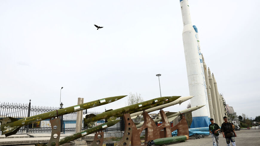 People walk near Iranian missiles in a park, amid the U.S.-Israeli conflict with Iran, in Tehran, Iran, March 26, 2026. Majid Asgaripour/WANA (West Asia News Agency) via REUTERS