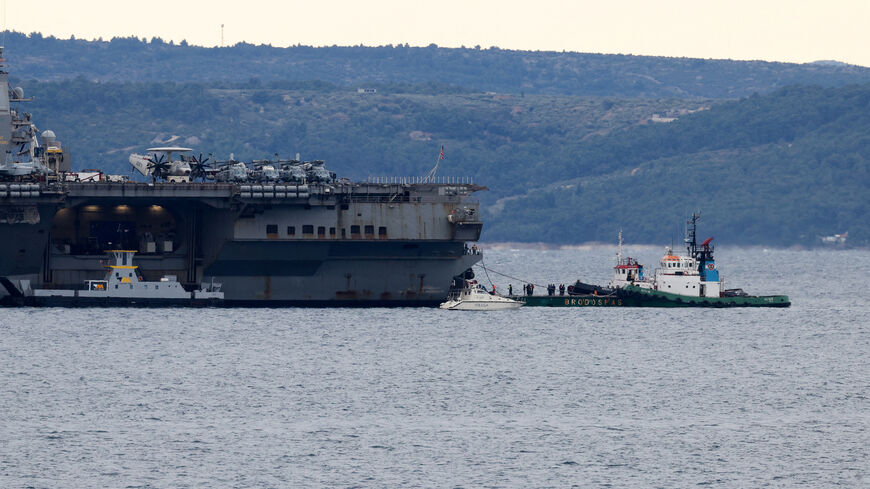 A ship carrying supplies to U.S. aircraft carrier "Gerald R. Ford" arrives as the aircraft carrier holds position in front of Split, in the Adriatic Sea, March 28, 2026. REUTERS/Antonio Bronic