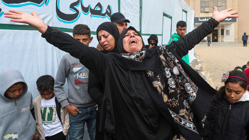 A woman mourns during the funeral of six Palestinians, including three policemen, killed in Israeli strikes, according to medics, at Nasser Hospital in Khan Younis in the southern Gaza Strip, March 29, 2026. REUTERS/Ramadan Abed