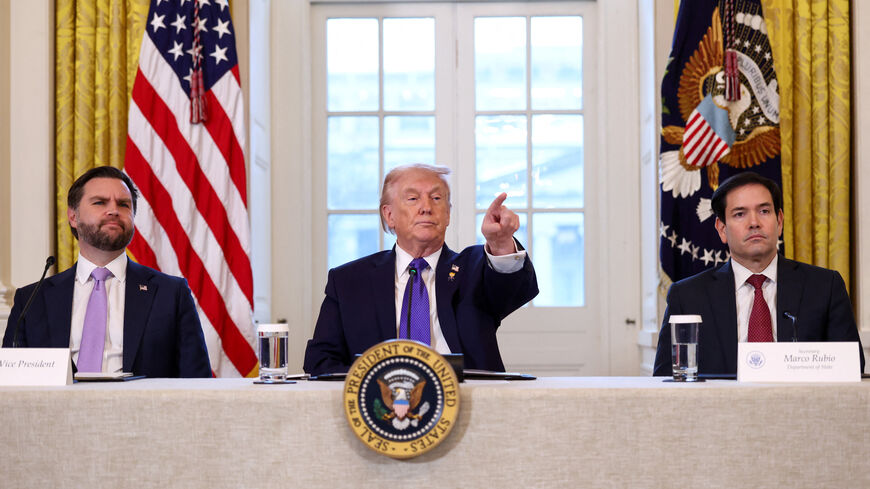 U.S. President Donald Trump takes questions from reporters while Vice President JD Vance and Secretary of State Marco Rubio look on, as they attend a meeting with oil industry executives, at the White House in Washington, D.C., U.S., January 9, 2026. REUTERS/Kevin Lamarque