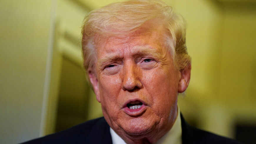 U.S. President Donald Trump talks to members of the media aboard Air Force One en route to Joint Base Andrews, Maryland, U.S., March 29, 2026. REUTERS/Elizabeth Frantz