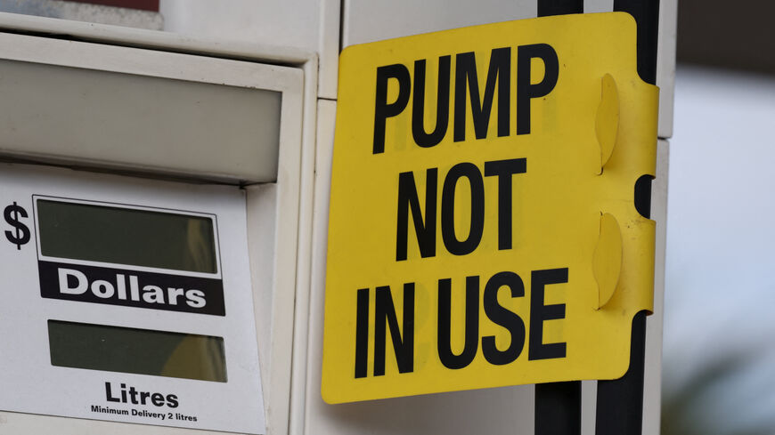 A "Pump not in use" sign is displayed on an empty fuel dispenser at a Shell petrol station that ran out of fuel, in Sydney, Australia, March 30, 2026. REUTERS/Hollie Adams