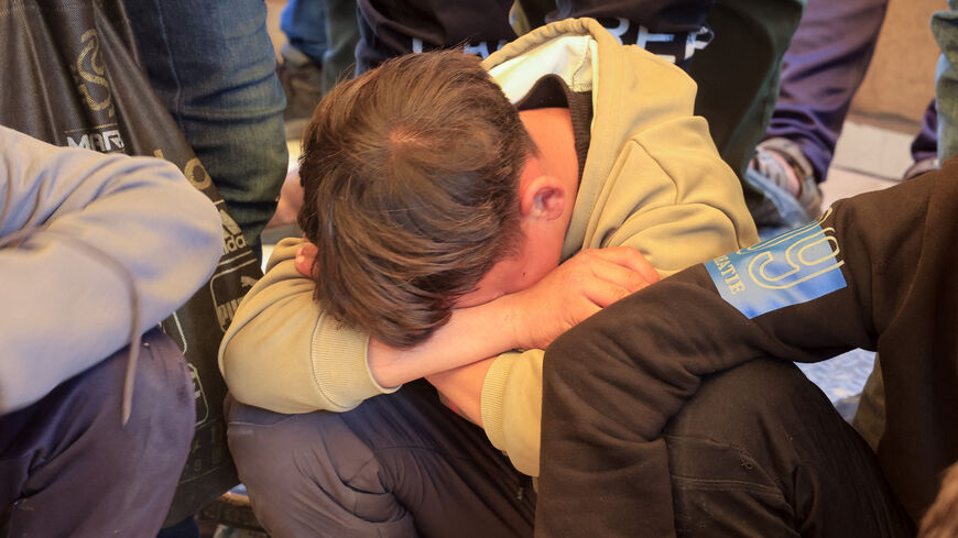 A mourner reacts during the funeral of Palestinian father Mahmoud Al-Bayouk and his two-year-old son Yahia, who were killed in an Israeli strike, according to medics, at Nasser Hospital in Khan Younis, in the southern Gaza Strip, March 31, 2026. REUTERS/Haseeb Alwazeer