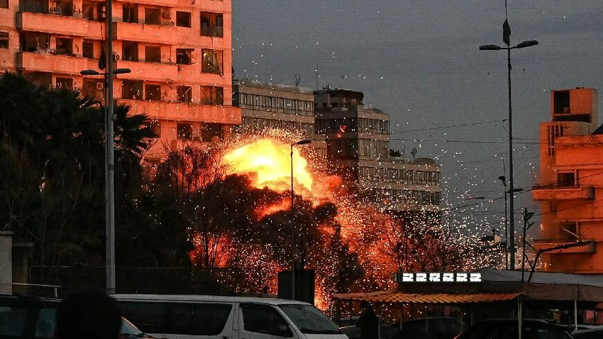 A fireball rises from the site of an Israeli air strike that targeted a building in Beirut
