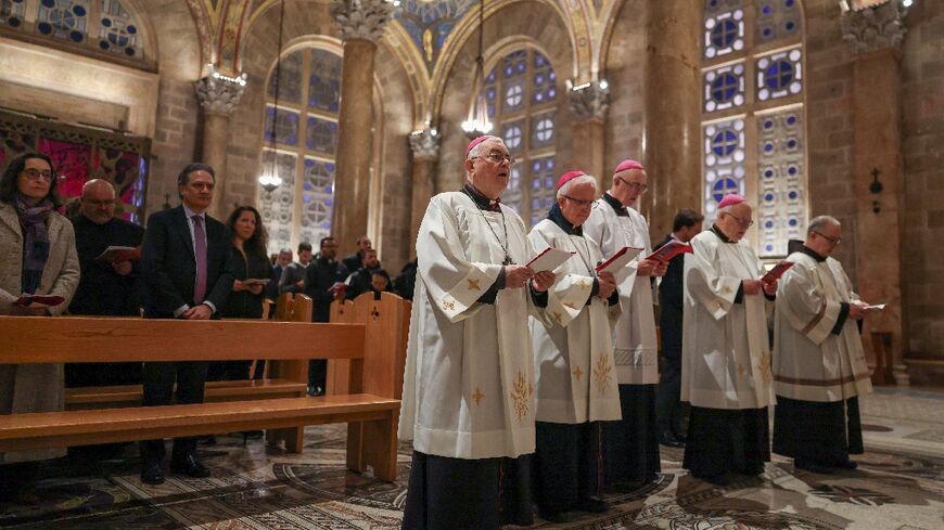 Members of the clergy and faithfuls attend a prayer service in the Church of All Nations held by Latin Patriarch of Jerusalem, Cardinal Pierbattista Pizzaballa, to mark Palm Sunday in Jerusalem