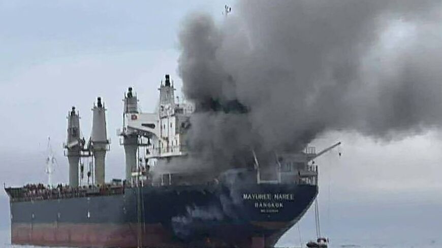Handout photo from the Royal Thai Navy shows smoke rising from a Thai bulk carrier near the Strait of Hormuz after an attack
