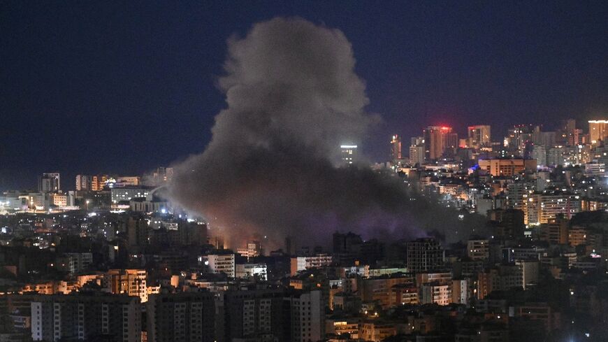 Smoke rises from the site of an Israeli airstrike that targeted an area in Beirut's southern neighborhood