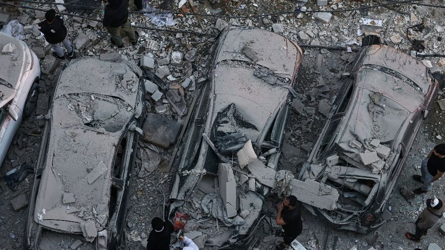 Residents gather at the site of an Israeli airstrike that targeted a building in the Aisha Bakkar neighbourhood of Beirut