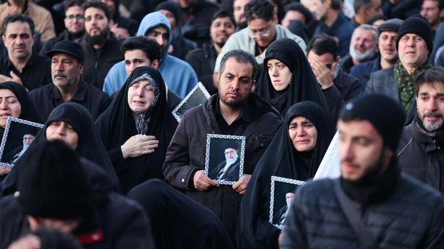 People mourn the death of Iran’s supreme leader Ayatollah Ali Khamenei, who was killed in joint US and Israeli strikes, at a square in Tehran 
