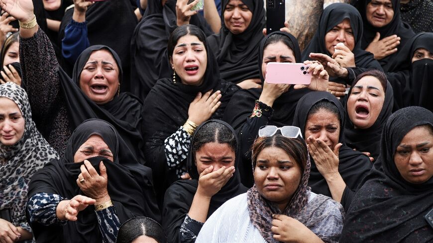 Iran's ISNA news agency released images of mourners at the funeral of children killed in the strike