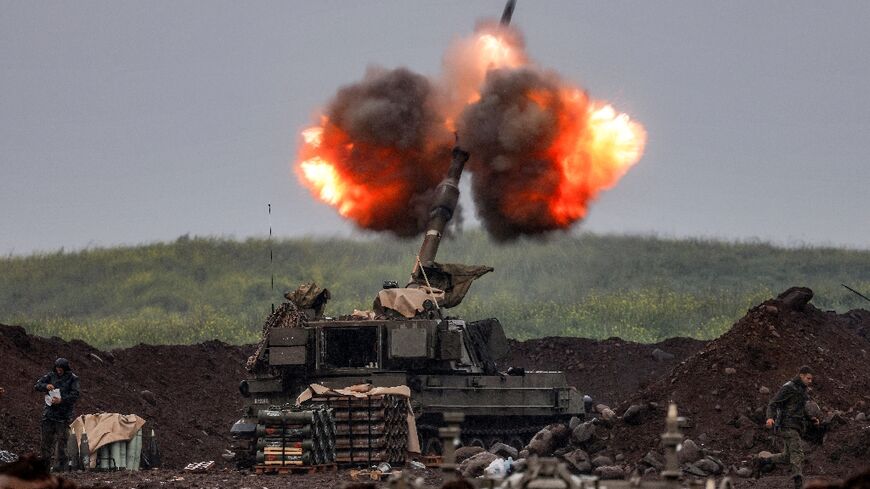 An Israeli self-propelled howitzer artillery gun fires rounds towards southern Lebanon from northern Israel