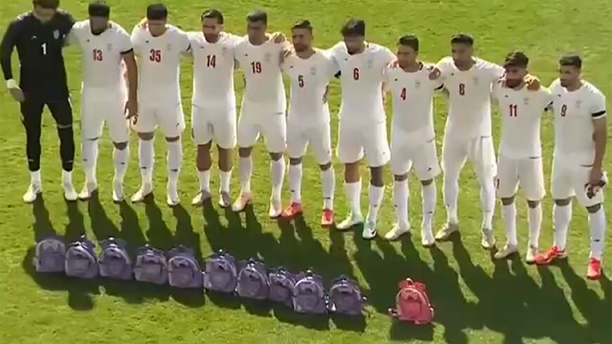 This video grab taken from images released by the Iranian state broadcaster (IRIB) on March 27, 2026 and released via AFPTV, shows the country's football national team paying tribute to the victims of the February 28 strike on an elementary school in Minab, ahead of their friendly football match with Nigeria in Turkey's Antalya