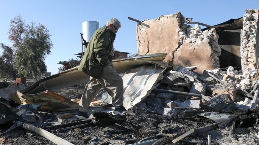 An Iranian Kurdish peshmerga member of the Kurdistan Democratic Party of Iran inspects the damage sustained at the Azadi Camp following an Iranian cross-border attack in the town of Koye, east of Erbil district, on March 3, 2026. 
