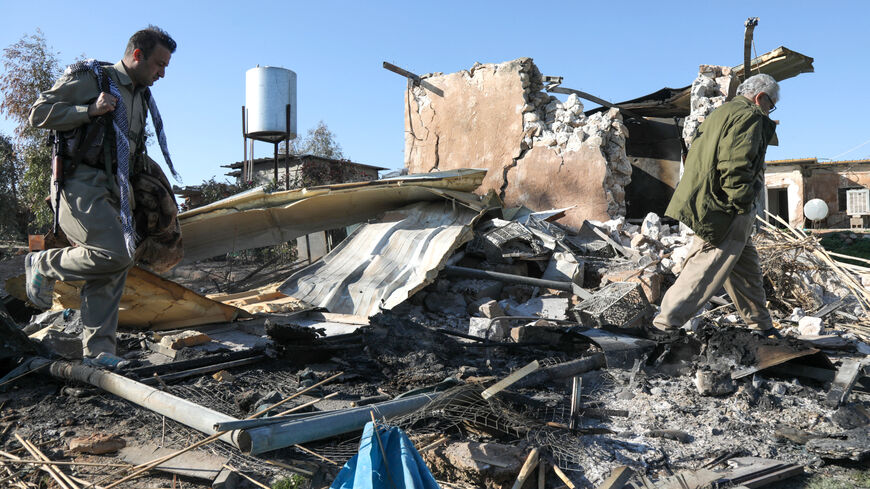 An Iranian Kurdish Peshmerga member of the Kurdistan Democratic Party of Iran (KDPI) inspects damage sustained at the Azadi Camp of the Kurdistan Democratic Party of Iran (KDPI) following an Iranian cross-border attack in the town of Koye (Koysinjaq), in the east of Erbil district in the autonomous Kurdish region of northern Iraq on March 3, 2026. The United States and Israel launched strikes against Iran on February 28, with the killing of Iran's supreme leader and the Islamic republic retaliated with barr