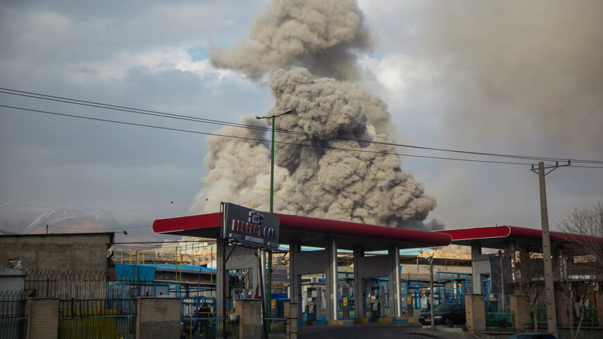 A plume of smoke rises after an explosion on March 2, 2026 in Tehran, Iran. 
