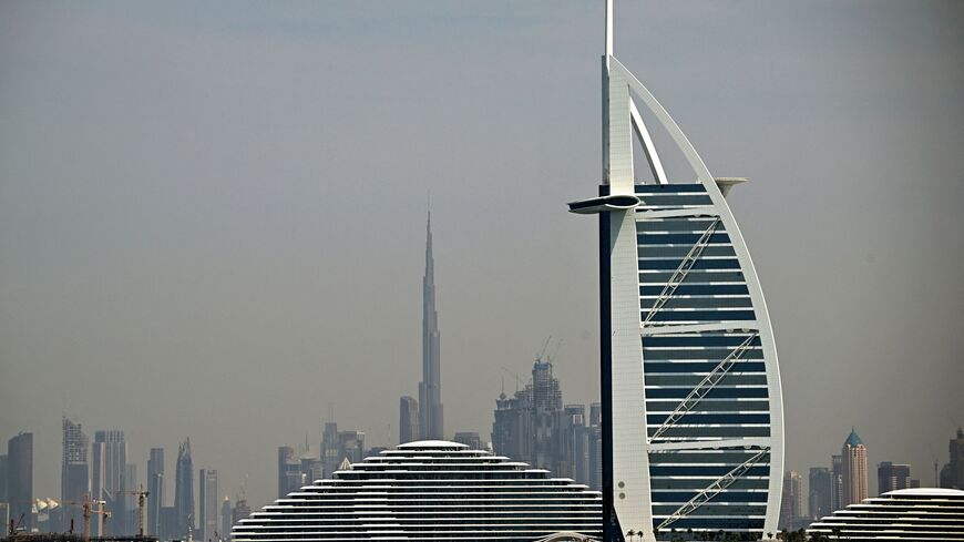 The city skyline is pictued in Dubai on March 11, 2026. The oil-rich Gulf has borne the brunt of Iran's attacks in response to US-Israeli strikes that sparked the Middle East war, with Tehran targeting US assets but also civilian infrastructure. (Photo by Giuseppe CACACE / AFP via Getty Images)