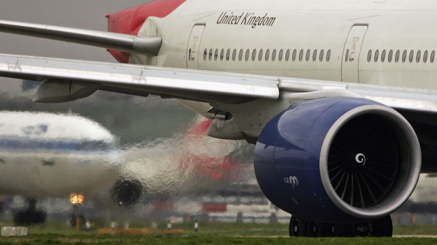 Exhaust emits from the engine of a passenger jet as it prepares for take off at Heathrow Airport on March 30, 2006, in London, England. 
