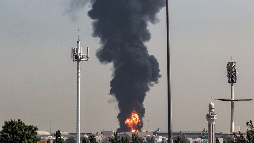Smoke rises from a fire near Dubai International Airport after a 'drone-related incident'