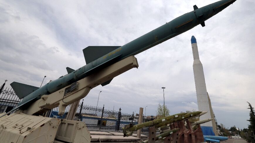 Mockups of Iranian-made missiles are displayed at an exhibition outside the Defence Museum in Tehran
