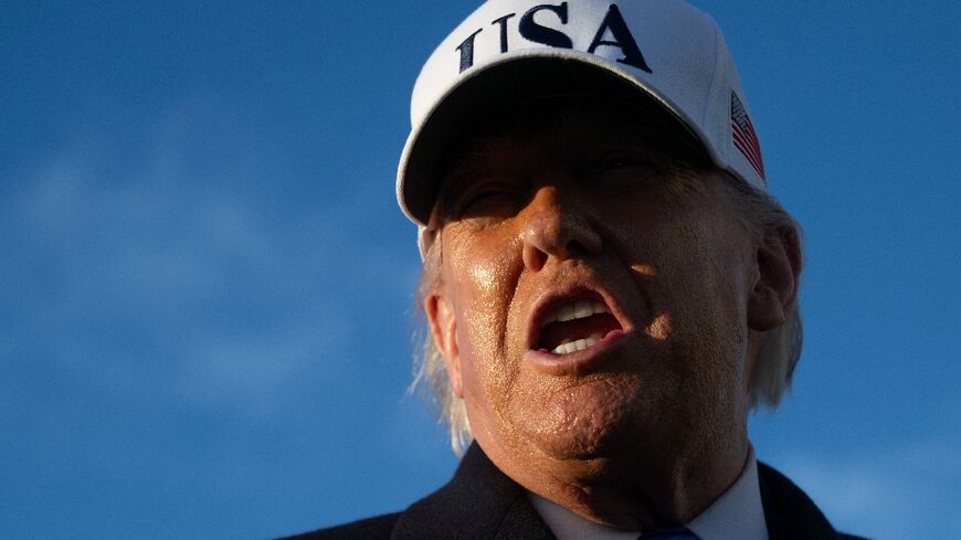 US President Donald Trump speaks to reporters before boarding Air Force One as he departs Joint Base Andrews in Maryland on March 13, 2026