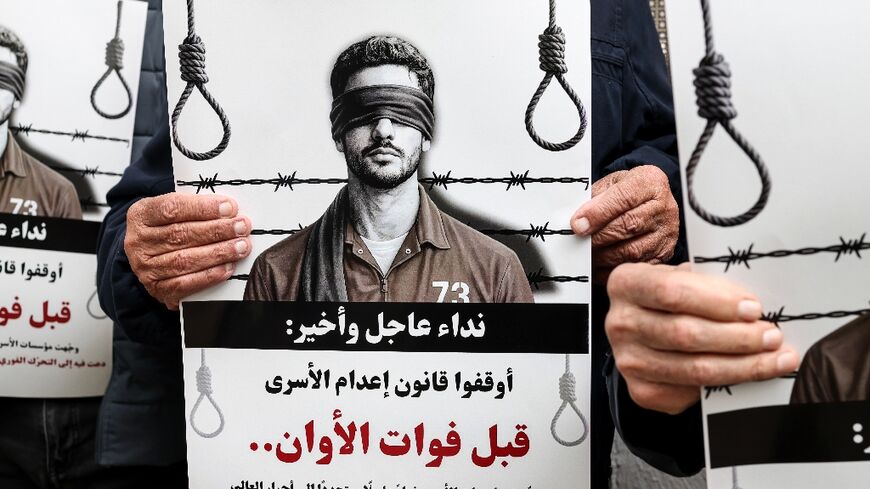 Palestinians in the Israeli-occupied West Bank protest against the new death penalty passed by Israeli parliament